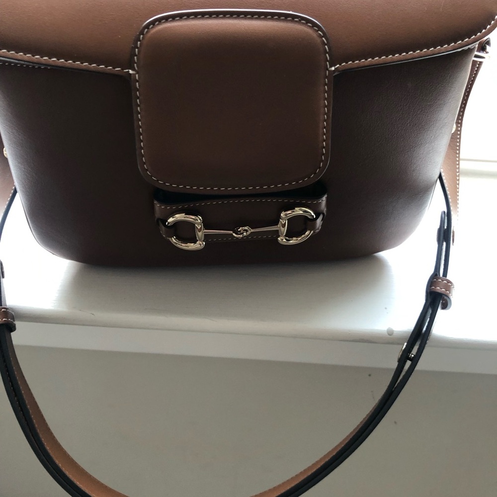 Gucci 1955 Horsebit medium brown leather adjustable shoulder bag.